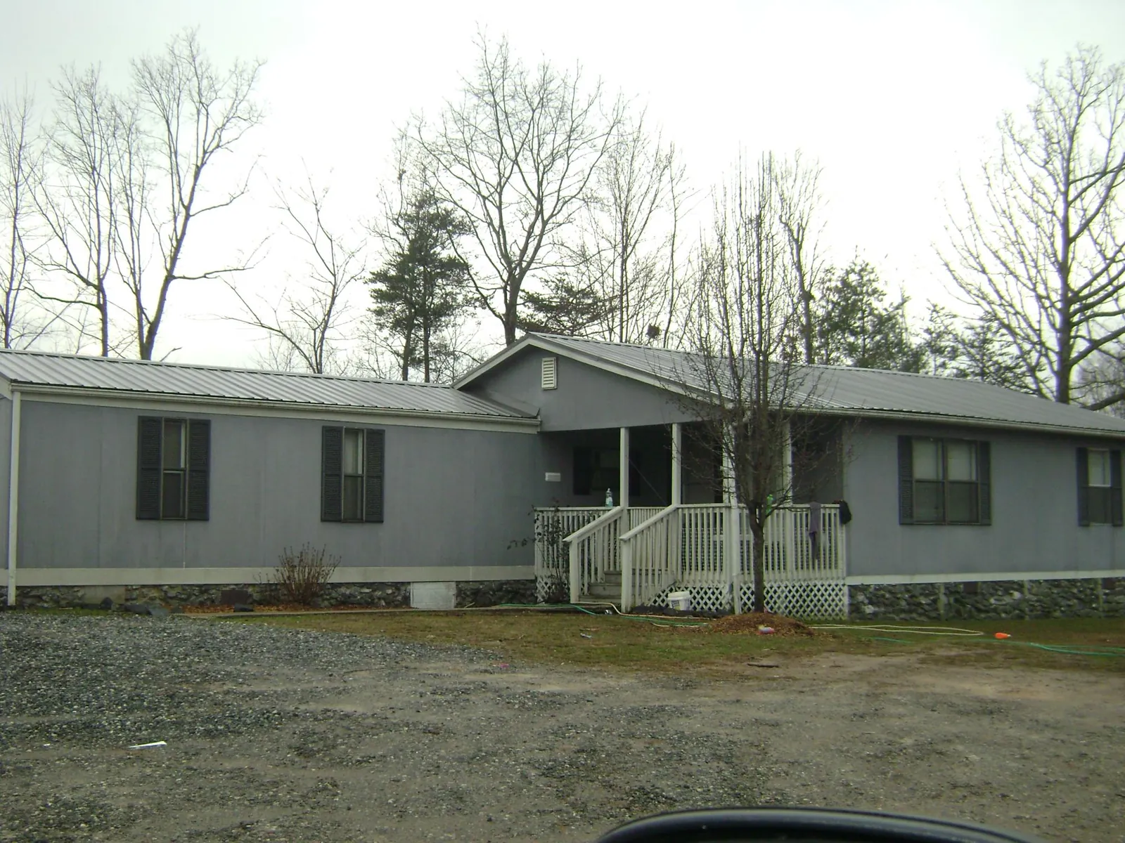 Metal roof over a manufactured home with a covered front porch in Sierra Vista